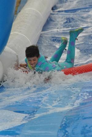 Ilminster Town FC fun day Part 12 – July 9, 2016: A giant water slide was the star attraction at a family fun day held to celebrate Ilminster Town Football Club’s new Archie Gooch Pavilion headquarters in Britten’s Field. Photo 22