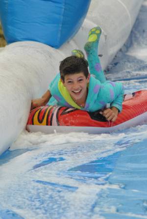 Ilminster Town FC fun day Part 12 – July 9, 2016: A giant water slide was the star attraction at a family fun day held to celebrate Ilminster Town Football Club’s new Archie Gooch Pavilion headquarters in Britten’s Field. Photo 23