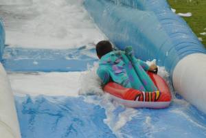Ilminster Town FC fun day Part 12 – July 9, 2016: A giant water slide was the star attraction at a family fun day held to celebrate Ilminster Town Football Club’s new Archie Gooch Pavilion headquarters in Britten’s Field. Photo 25