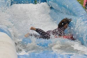 Ilminster Town FC fun day Part 12 – July 9, 2016: A giant water slide was the star attraction at a family fun day held to celebrate Ilminster Town Football Club’s new Archie Gooch Pavilion headquarters in Britten’s Field. Photo 27