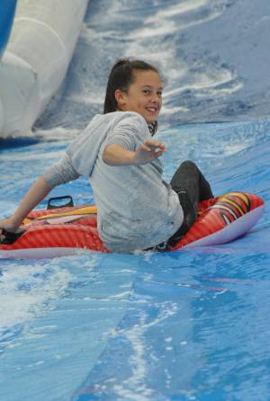 Ilminster Town FC fun day Part 12 – July 9, 2016: A giant water slide was the star attraction at a family fun day held to celebrate Ilminster Town Football Club’s new Archie Gooch Pavilion headquarters in Britten’s Field. Photo 2