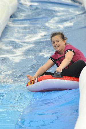 Ilminster Town FC fun day Part 12 – July 9, 2016: A giant water slide was the star attraction at a family fun day held to celebrate Ilminster Town Football Club’s new Archie Gooch Pavilion headquarters in Britten’s Field. Photo 5