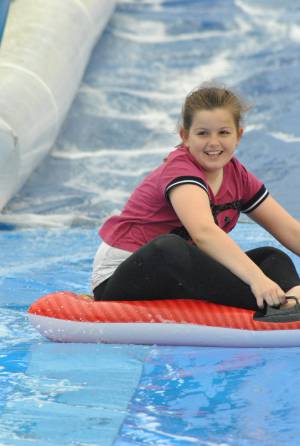 Ilminster Town FC fun day Part 12 – July 9, 2016: A giant water slide was the star attraction at a family fun day held to celebrate Ilminster Town Football Club’s new Archie Gooch Pavilion headquarters in Britten’s Field. Photo 6