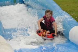 Ilminster Town FC fun day Part 12 – July 9, 2016: A giant water slide was the star attraction at a family fun day held to celebrate Ilminster Town Football Club’s new Archie Gooch Pavilion headquarters in Britten’s Field. Photo 7