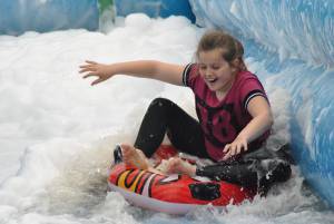 Ilminster Town FC fun day Part 12 – July 9, 2016: A giant water slide was the star attraction at a family fun day held to celebrate Ilminster Town Football Club’s new Archie Gooch Pavilion headquarters in Britten’s Field. Photo 8