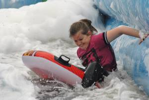 Ilminster Town FC fun day Part 12 – July 9, 2016: A giant water slide was the star attraction at a family fun day held to celebrate Ilminster Town Football Club’s new Archie Gooch Pavilion headquarters in Britten’s Field. Photo 9