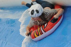 Ilminster Town FC fun day Part 14 – July 9, 2016: A giant water slide was the star attraction at a family fun day held to celebrate Ilminster Town Football Club’s new Archie Gooch Pavilion headquarters in Britten’s Field. Photo 14
