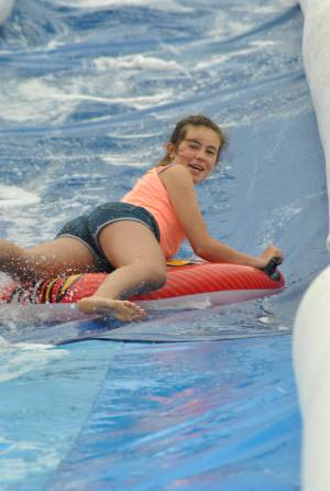 Ilminster Town FC fun day Part 14 – July 9, 2016: A giant water slide was the star attraction at a family fun day held to celebrate Ilminster Town Football Club’s new Archie Gooch Pavilion headquarters in Britten’s Field. Photo 17