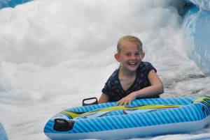 Ilminster Town FC fun day Part 14 – July 9, 2016: A giant water slide was the star attraction at a family fun day held to celebrate Ilminster Town Football Club’s new Archie Gooch Pavilion headquarters in Britten’s Field. Photo 1