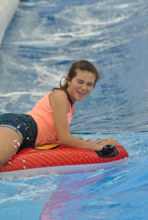 Ilminster Town FC fun day Part 14 – July 9, 2016: A giant water slide was the star attraction at a family fun day held to celebrate Ilminster Town Football Club’s new Archie Gooch Pavilion headquarters in Britten’s Field. Photo 18