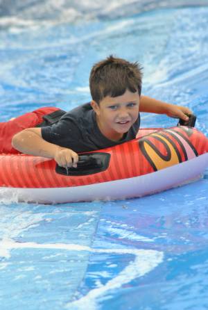 Ilminster Town FC fun day Part 14 – July 9, 2016: A giant water slide was the star attraction at a family fun day held to celebrate Ilminster Town Football Club’s new Archie Gooch Pavilion headquarters in Britten’s Field. Photo 20