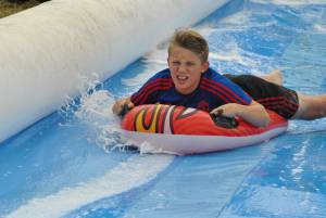 Ilminster Town FC fun day Part 14 – July 9, 2016: A giant water slide was the star attraction at a family fun day held to celebrate Ilminster Town Football Club’s new Archie Gooch Pavilion headquarters in Britten’s Field. Photo 21
