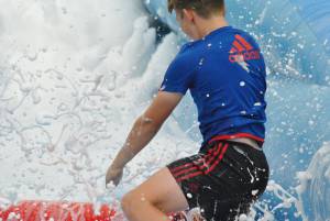 Ilminster Town FC fun day Part 14 – July 9, 2016: A giant water slide was the star attraction at a family fun day held to celebrate Ilminster Town Football Club’s new Archie Gooch Pavilion headquarters in Britten’s Field. Photo 22