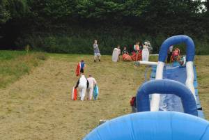 Ilminster Town FC fun day Part 14 – July 9, 2016: A giant water slide was the star attraction at a family fun day held to celebrate Ilminster Town Football Club’s new Archie Gooch Pavilion headquarters in Britten’s Field. Photo 3
