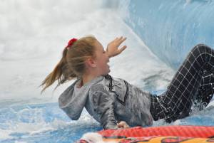 Ilminster Town FC fun day Part 14 – July 9, 2016: A giant water slide was the star attraction at a family fun day held to celebrate Ilminster Town Football Club’s new Archie Gooch Pavilion headquarters in Britten’s Field. Photo 4