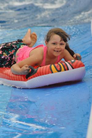 Ilminster Town FC fun day Part 14 – July 9, 2016: A giant water slide was the star attraction at a family fun day held to celebrate Ilminster Town Football Club’s new Archie Gooch Pavilion headquarters in Britten’s Field. Photo 7