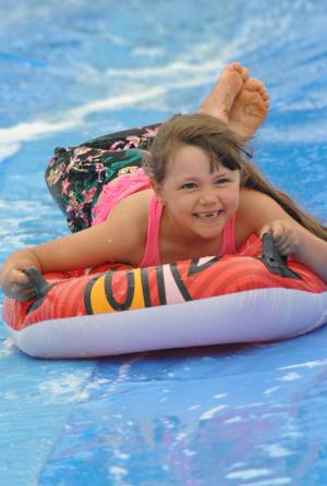 Ilminster Town FC fun day Part 14 – July 9, 2016: A giant water slide was the star attraction at a family fun day held to celebrate Ilminster Town Football Club’s new Archie Gooch Pavilion headquarters in Britten’s Field. Photo 8