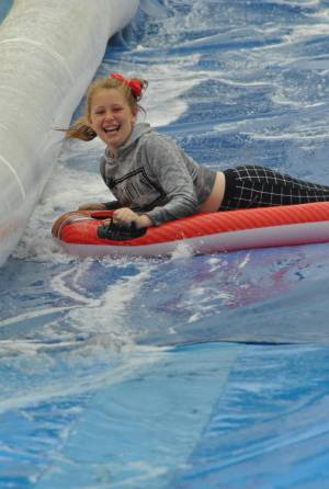 Ilminster Town FC fun day Part 15 – July 9, 2016: A giant water slide was the star attraction at a family fun day held to celebrate Ilminster Town Football Club’s new Archie Gooch Pavilion headquarters in Britten’s Field. Photo 10