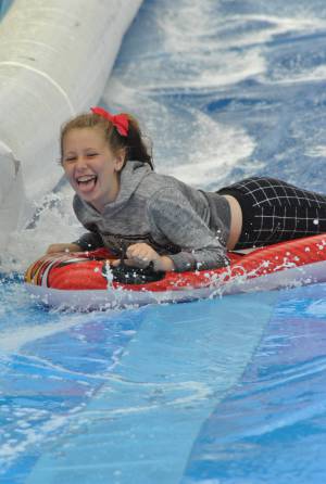 Ilminster Town FC fun day Part 15 – July 9, 2016: A giant water slide was the star attraction at a family fun day held to celebrate Ilminster Town Football Club’s new Archie Gooch Pavilion headquarters in Britten’s Field. Photo 11