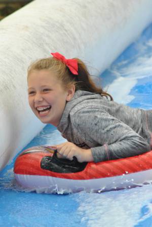 Ilminster Town FC fun day Part 15 – July 9, 2016: A giant water slide was the star attraction at a family fun day held to celebrate Ilminster Town Football Club’s new Archie Gooch Pavilion headquarters in Britten’s Field. Photo 12