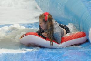Ilminster Town FC fun day Part 15 – July 9, 2016: A giant water slide was the star attraction at a family fun day held to celebrate Ilminster Town Football Club’s new Archie Gooch Pavilion headquarters in Britten’s Field. Photo 13