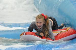 Ilminster Town FC fun day Part 15 – July 9, 2016: A giant water slide was the star attraction at a family fun day held to celebrate Ilminster Town Football Club’s new Archie Gooch Pavilion headquarters in Britten’s Field. Photo 14