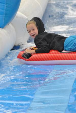 Ilminster Town FC fun day Part 15 – July 9, 2016: A giant water slide was the star attraction at a family fun day held to celebrate Ilminster Town Football Club’s new Archie Gooch Pavilion headquarters in Britten’s Field. Photo 17