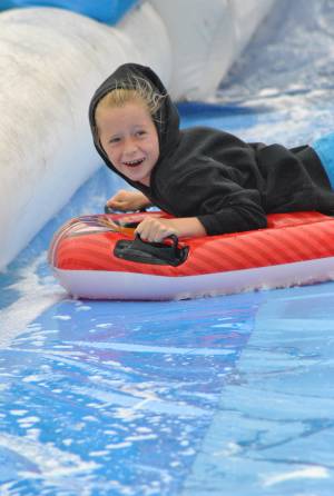 Ilminster Town FC fun day Part 15 – July 9, 2016: A giant water slide was the star attraction at a family fun day held to celebrate Ilminster Town Football Club’s new Archie Gooch Pavilion headquarters in Britten’s Field. Photo 18