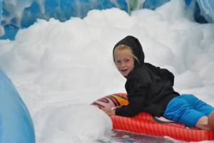 Ilminster Town FC fun day Part 15 – July 9, 2016: A giant water slide was the star attraction at a family fun day held to celebrate Ilminster Town Football Club’s new Archie Gooch Pavilion headquarters in Britten’s Field. Photo 19