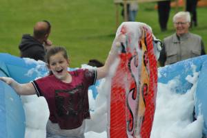 Ilminster Town FC fun day Part 15 – July 9, 2016: A giant water slide was the star attraction at a family fun day held to celebrate Ilminster Town Football Club’s new Archie Gooch Pavilion headquarters in Britten’s Field. Photo 27
