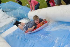 Ilminster Town FC fun day Part 15 – July 9, 2016: A giant water slide was the star attraction at a family fun day held to celebrate Ilminster Town Football Club’s new Archie Gooch Pavilion headquarters in Britten’s Field. Photo 28