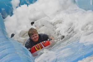 Ilminster Town FC fun day Part 15 – July 9, 2016: A giant water slide was the star attraction at a family fun day held to celebrate Ilminster Town Football Club’s new Archie Gooch Pavilion headquarters in Britten’s Field. Photo 30
