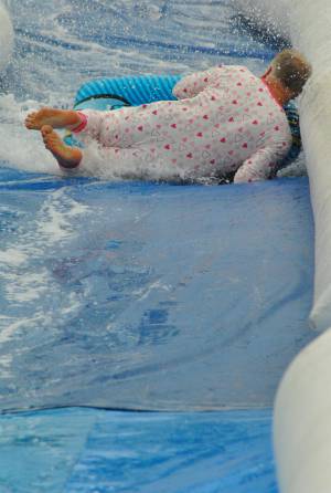Ilminster Town FC fun day Part 15 – July 9, 2016: A giant water slide was the star attraction at a family fun day held to celebrate Ilminster Town Football Club’s new Archie Gooch Pavilion headquarters in Britten’s Field. Photo 3