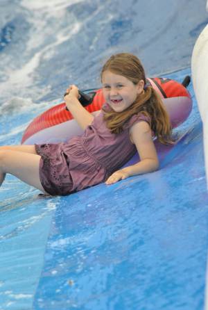 Ilminster Town FC fun day Part 16 – July 9, 2016: A giant water slide was the star attraction at a family fun day held to celebrate Ilminster Town Football Club’s new Archie Gooch Pavilion headquarters in Britten’s Field. Photo 10