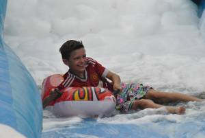 Ilminster Town FC fun day Part 16 – July 9, 2016: A giant water slide was the star attraction at a family fun day held to celebrate Ilminster Town Football Club’s new Archie Gooch Pavilion headquarters in Britten’s Field. Photo 12