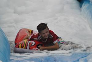 Ilminster Town FC fun day Part 16 – July 9, 2016: A giant water slide was the star attraction at a family fun day held to celebrate Ilminster Town Football Club’s new Archie Gooch Pavilion headquarters in Britten’s Field. Photo 13