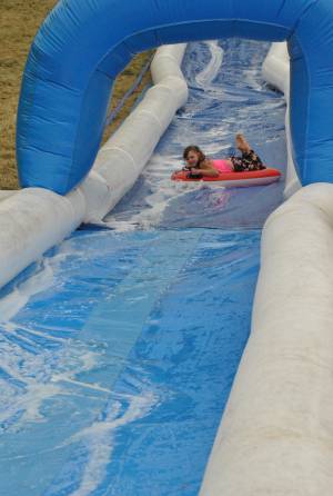 Ilminster Town FC fun day Part 16 – July 9, 2016: A giant water slide was the star attraction at a family fun day held to celebrate Ilminster Town Football Club’s new Archie Gooch Pavilion headquarters in Britten’s Field. Photo 14