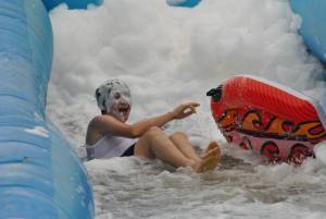 Ilminster Town FC fun day Part 16 – July 9, 2016: A giant water slide was the star attraction at a family fun day held to celebrate Ilminster Town Football Club’s new Archie Gooch Pavilion headquarters in Britten’s Field. Photo 17