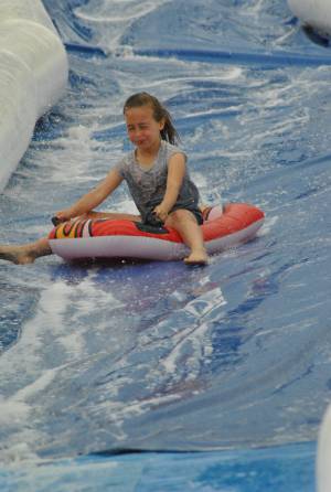 Ilminster Town FC fun day Part 16 – July 9, 2016: A giant water slide was the star attraction at a family fun day held to celebrate Ilminster Town Football Club’s new Archie Gooch Pavilion headquarters in Britten’s Field. Photo 8