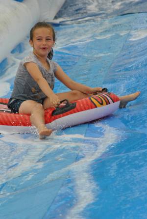 Ilminster Town FC fun day Part 16 – July 9, 2016: A giant water slide was the star attraction at a family fun day held to celebrate Ilminster Town Football Club’s new Archie Gooch Pavilion headquarters in Britten’s Field. Photo 9