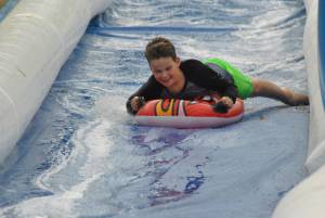 Ilminster Town FC fun day Part 17 – July 9, 2016: A giant water slide was the star attraction at a family fun day held to celebrate Ilminster Town Football Club’s new Archie Gooch Pavilion headquarters in Britten’s Field. Photo 11