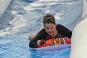 Ilminster Town FC fun day Part 17 – July 9, 2016: A giant water slide was the star attraction at a family fun day held to celebrate Ilminster Town Football Club’s new Archie Gooch Pavilion headquarters in Britten’s Field. Photo 12