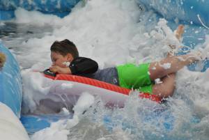 Ilminster Town FC fun day Part 17 – July 9, 2016: A giant water slide was the star attraction at a family fun day held to celebrate Ilminster Town Football Club’s new Archie Gooch Pavilion headquarters in Britten’s Field. Photo 13
