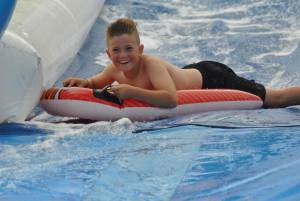 Ilminster Town FC fun day Part 17 – July 9, 2016: A giant water slide was the star attraction at a family fun day held to celebrate Ilminster Town Football Club’s new Archie Gooch Pavilion headquarters in Britten’s Field. Photo 15