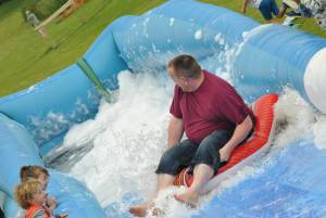 Ilminster Town FC fun day Part 17 – July 9, 2016: A giant water slide was the star attraction at a family fun day held to celebrate Ilminster Town Football Club’s new Archie Gooch Pavilion headquarters in Britten’s Field. Photo 18