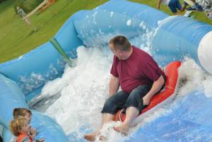 Ilminster Town FC fun day Part 17 – July 9, 2016: A giant water slide was the star attraction at a family fun day held to celebrate Ilminster Town Football Club’s new Archie Gooch Pavilion headquarters in Britten’s Field. Photo 18