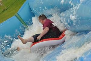 Ilminster Town FC fun day Part 17 – July 9, 2016: A giant water slide was the star attraction at a family fun day held to celebrate Ilminster Town Football Club’s new Archie Gooch Pavilion headquarters in Britten’s Field. Photo 19