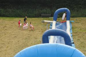 Ilminster Town FC fun day Part 17 – July 9, 2016: A giant water slide was the star attraction at a family fun day held to celebrate Ilminster Town Football Club’s new Archie Gooch Pavilion headquarters in Britten’s Field. Photo 27