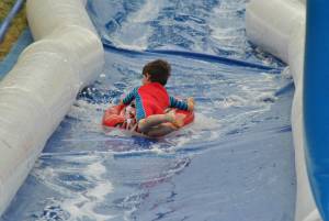 Ilminster Town FC fun day Part 17 – July 9, 2016: A giant water slide was the star attraction at a family fun day held to celebrate Ilminster Town Football Club’s new Archie Gooch Pavilion headquarters in Britten’s Field. Photo 28