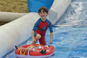 Ilminster Town FC fun day Part 17 – July 9, 2016: A giant water slide was the star attraction at a family fun day held to celebrate Ilminster Town Football Club’s new Archie Gooch Pavilion headquarters in Britten’s Field. Photo 29